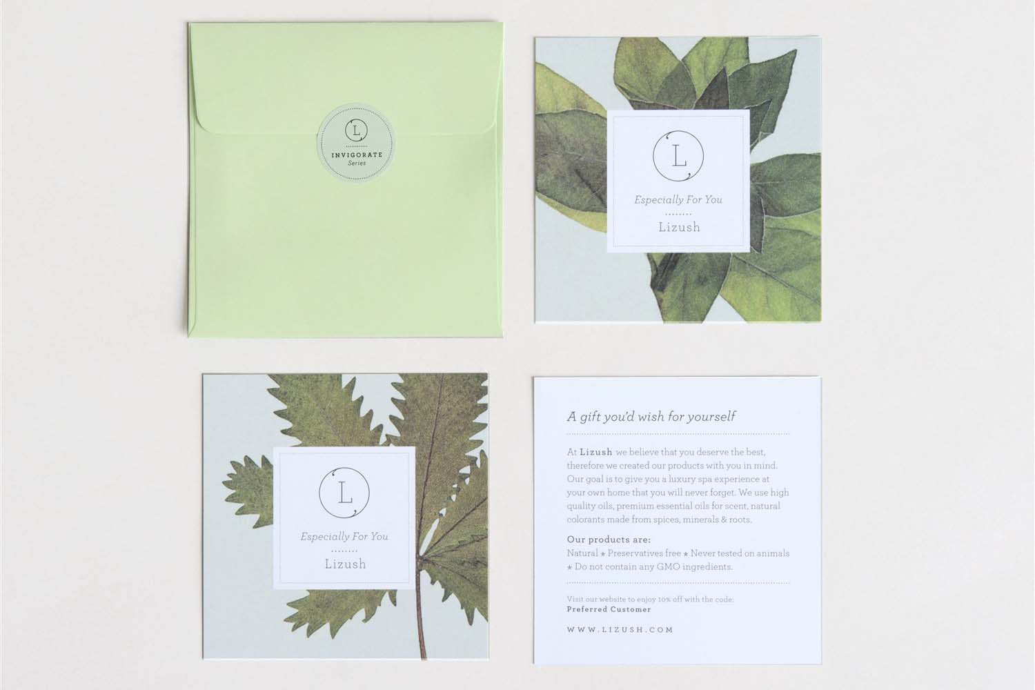 Eco-friendly gift cards featuring botanical designs and a green envelope for sustainable gifting.